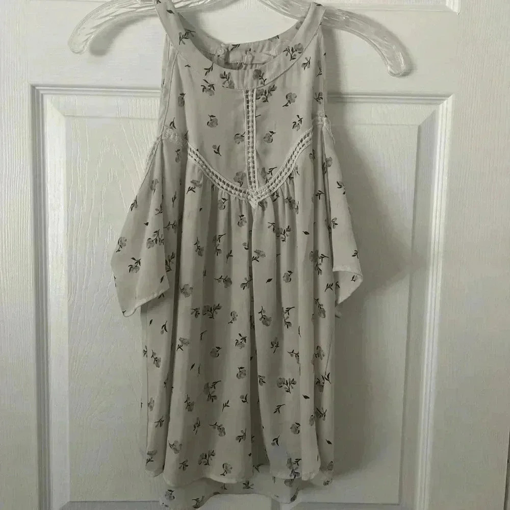 Sienna Sky Woman’s Floral Cut Out Blouse